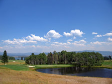 The beautiful downhill par three 3rd at Tamarack with Lake Cascade resting in the distance